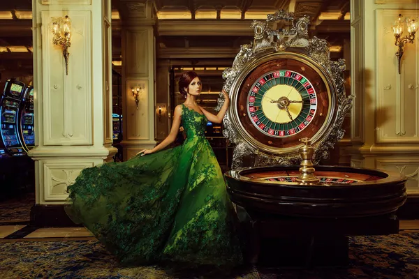 A close-up shot of golden coins falling around a spinning roulette wheel, representing immersive casino action at 09DET.